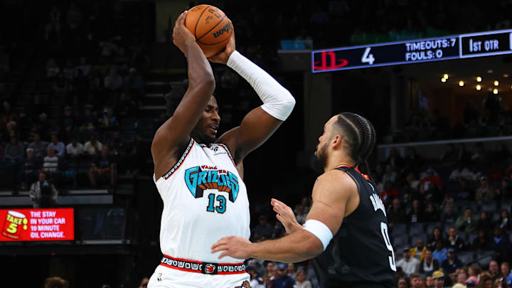 Jan 30, 2025; Memphis, Tennessee, USA; Memphis Grizzlies forward Jaren Jackson Jr. (13) handles the ball as Houston Rockets forward Dillon Brooks (9) defends during the first quarter at FedExForum. Mandatory Credit: Petre Thomas-Imagn Images