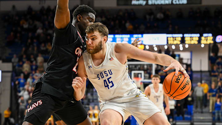 South Dakota State Jackrabbits center Oscar Cluff (45) posts up against Omaha Mavericks forward Valentino Simon (21) South Dakota State Jackrabbits center Oscar Cluff (45) posts up against Omaha Mavericks forward Valentino Simon (21)