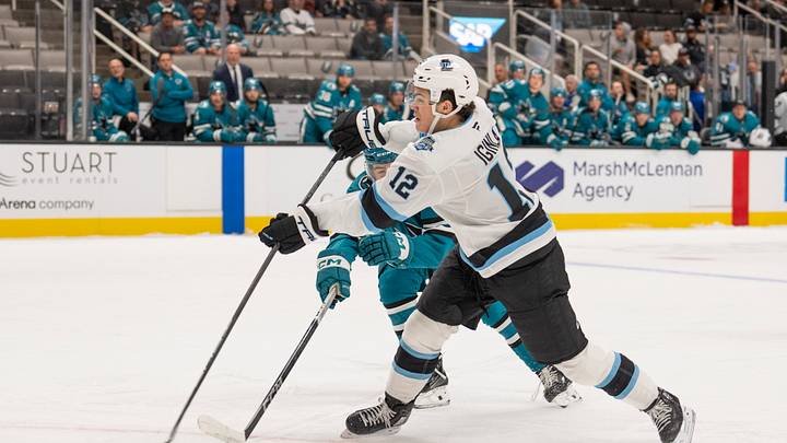 Oct 1, 2024; San Jose, California, USA; Utah Hockey Club forward Tij Iginla (12) shoots the puck during the first period against San Jose Sharks defenseman Luca Cagnoni (42) at SAP Center at San Jose. Mandatory Credit: Stan Szeto-Imagn Images Oct 1, 2024; San Jose, California, USA; Utah Hockey Club forward Tij Iginla (12) shoots the puck during the first period against San Jose Sharks defenseman Luca Cagnoni (42) at SAP Center at San Jose. Mandatory Credit: Stan Szeto-Imagn Images