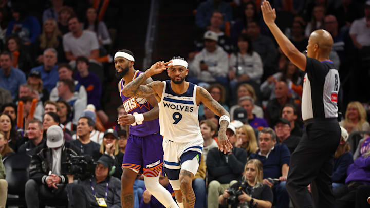 Jan 29, 2025; Phoenix, Arizona, USA; Minnesota Timberwolves guard Nickeil Alexander-Walker (9) reacts after a basket against the Phoenix Suns in the second half at Footprint Center. Mandatory Credit: Mark J. Rebilas-Imagn Images