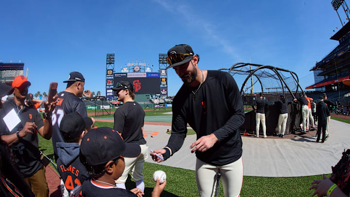 May 9, 2026; San Francisco, California, USA; San Francisco Giants infielder Bryce Eldridge (8) signs an autograph for a fan before the game against the Pittsburgh Pirates at Oracle Park. Mandatory Credit: Robert Edwards-Imagn Images