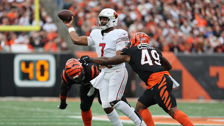 Dec 28, 2025; Cincinnati, Ohio, USA; Arizona Cardinals quarterback Jacoby Brissett (7) throws against Cincinnati Bengals linebacker Barrett Carter (49) during the second half at Paycor Stadium. Mandatory Credit: Joseph Maiorana-Imagn Images