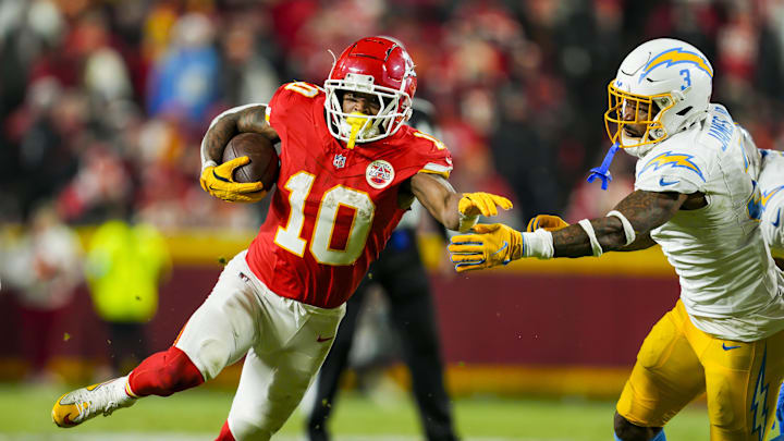 Dec 8, 2024; Kansas City, Missouri, USA; Kansas City Chiefs running back Isiah Pacheco (10) runs with the ball against Los Angeles Chargers safety Derwin James Jr. (3) during the second half at GEHA Field at Arrowhead Stadium. Mandatory Credit: Jay Biggerstaff-Imagn Images Dec 8, 2024; Kansas City, Missouri, USA; Kansas City Chiefs running back Isiah Pacheco (10) runs with the ball against Los Angeles Chargers safety Derwin James Jr. (3) during the second half at GEHA Field at Arrowhead Stadium. Mandatory Credit: Jay Biggerstaff-Imagn Images