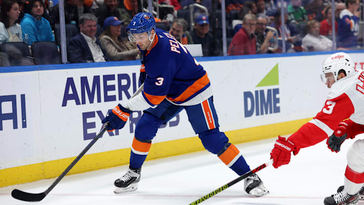 Oct 22, 2024; Elmont, New York, USA; New York Islanders defenseman Adam Pelech (3) skates with the puck against Detroit Red Wings right wing Alex DeBrincat (93) during the third period at UBS Arena. Mandatory Credit: Brad Penner-Imagn Images Oct 22, 2024; Elmont, New York, USA; New York Islanders defenseman Adam Pelech (3) skates with the puck against Detroit Red Wings right wing Alex DeBrincat (93) during the third period at UBS Arena. Mandatory Credit: Brad Penner-Imagn Images