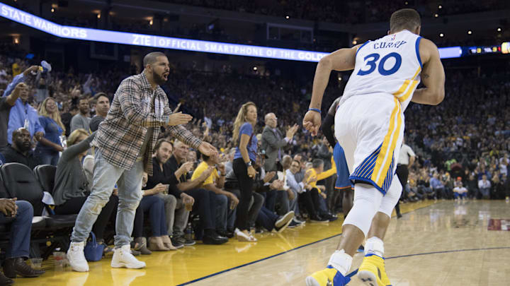 November 3, 2016; Oakland, CA, USA; Recording artist Drake celebrates after Golden State Warriors guard Stephen Curry (30) made a three-point basket against the Oklahoma City Thunder during the third quarter at Oracle Arena. The Warriors defeated the Thunder 122-96. Mandatory Credit: Kyle Terada-Imagn Images November 3, 2016; Oakland, CA, USA; Recording artist Drake celebrates after Golden State Warriors guard Stephen Curry (30) made a three-point basket against the Oklahoma City Thunder during the third quarter at Oracle Arena. The Warriors defeated the Thunder 122-96. Mandatory Credit: Kyle Terada-Imagn Images
