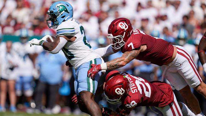 Oklahoma Sooners linebacker Danny Stutsman (28) and Oklahoma Sooners linebacker Jaren Kanak (7) bring down Tulane Green Wave running back Arnold Barnes III (20) during a college football game between the University of Oklahoma Sooners (OU) and the Tulane Green Wave at Gaylord Family - Oklahoma Memorial Stadium in Norman, Okla., Saturday, Sept. 14, 2024. Oklahoma Sooners linebacker Danny Stutsman (28) and Oklahoma Sooners linebacker Jaren Kanak (7) bring down Tulane Green Wave running back Arnold Barnes III (20) during a college football game between the University of Oklahoma Sooners (OU) and the Tulane Green Wave at Gaylord Family - Oklahoma Memorial Stadium in Norman, Okla., Saturday, Sept. 14, 2024.