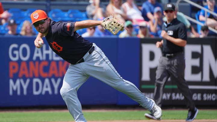 Mar 10, 2024; Port St. Lucie, Florida, USA;  Detroit Tigers third baseman Buddy Kennedy (70) makes a bare-handed play in the fourth inning against the New York Mets at Clover Park. Mandatory Credit: Jim Rassol-Imagn Images
