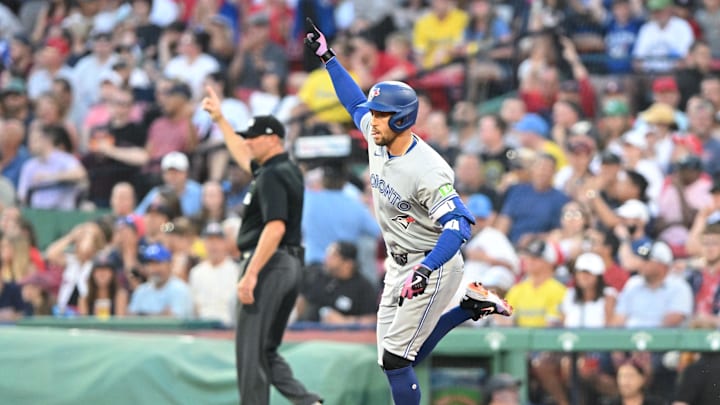 Jun 25, 2024; Boston, Massachusetts, USA; Toronto Blue Jays right fielder George Springer (4) reacts after hitting a two-run home run against the Boston Red Sox during the third inning at Fenway Park. Mandatory Credit: Brian Fluharty-USA TODAY Sports