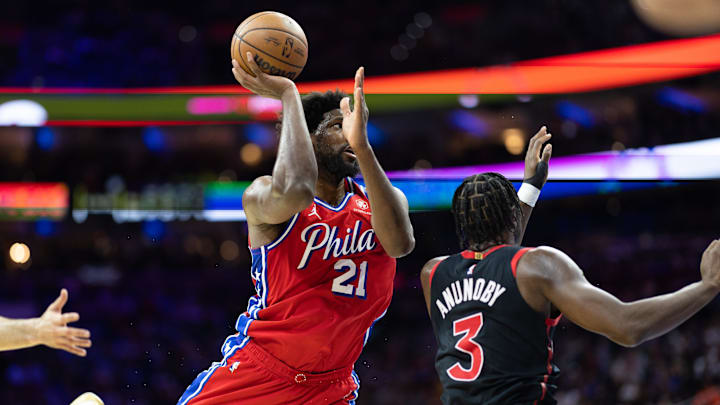 Mar 31, 2023; Philadelphia, Pennsylvania, USA; Philadelphia 76ers center Joel Embiid (21) drives for a shot against Toronto Raptors forward O.G. Anunoby (3) during the fourth quarter at Wells Fargo Center. Mandatory Credit: Bill Streicher-Imagn Images