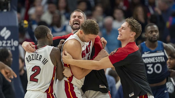 Nov 10, 2024; Minneapolis, Minnesota, USA; Miami Heat forward Nikola Jovic (5) (middle) celebrates with teammates after defeating the Minnesota Timberwolves at Target Center. Nov 10, 2024; Minneapolis, Minnesota, USA; Miami Heat forward Nikola Jovic (5) (middle) celebrates with teammates after defeating the Minnesota Timberwolves at Target Center.