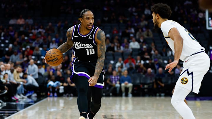 Dec 11, 2025; Sacramento, California, USA; Sacramento Kings guard Demar Derozan (10) controls the ball during the first quarter against Denver Nuggets forward Cameron Johnson (23) at Golden 1 Center. Mandatory Credit: Sergio Estrada-Imagn Images