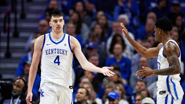 Jan 24, 2026; Lexington, Kentucky, USA; Kentucky Wildcats forward Andrija Jelavic (4) fives guard Otega Oweh (00) during the second half against the Mississippi Rebels at Rupp Arena at Central Bank Center. Mandatory Credit: Jordan Prather-Imagn Images Jan 24, 2026; Lexington, Kentucky, USA; Kentucky Wildcats forward Andrija Jelavic (4) fives guard Otega Oweh (00) during the second half against the Mississippi Rebels at Rupp Arena at Central Bank Center. Mandatory Credit: Jordan Prather-Imagn Images