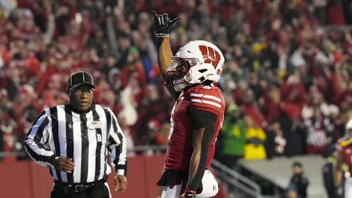 Nov 16, 2024; Madison, Wisconsin, USA;  Wisconsin Badgers wide receiver Will Pauling (6) celebrates after scoring a touchdown during the second quarter against the Oregon Ducks at Camp Randall Stadium. Mandatory Credit: Jeff Hanisch-Imagn Images