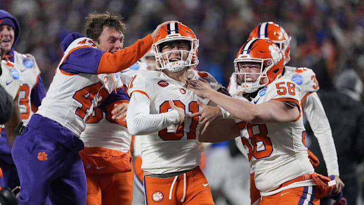 Dec 7, 2024; Charlotte, NC, USA; Clemson Tigers place kicker Nolan Hauser (81) celebrates with teammates after making a 56-yard field goal as time expired in the fourth quarter to win the 2024 ACC Championship game against the Southern Methodist Mustangs at Bank of America Stadium. Mandatory Credit: Jim Dedmon-Imagn Images