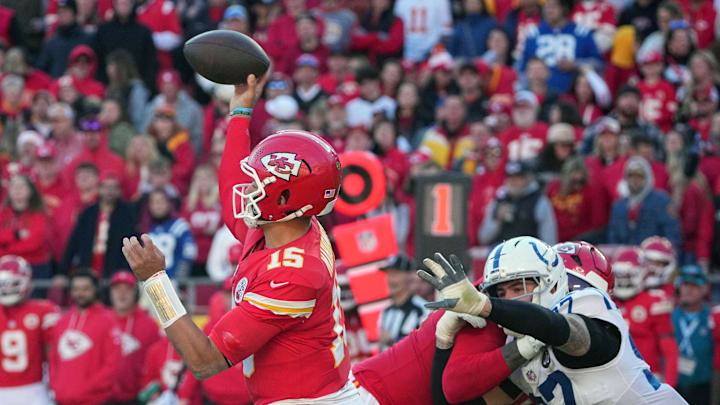 Nov 23, 2025; Kansas City, Missouri, USA; Kansas City Chiefs quarterback Patrick Mahomes (15) throws a pass against Indianapolis Colts defensive end Laiatu Latu (97) in the second half at GEHA Field at Arrowhead Stadium. Mandatory Credit: Denny Medley-Imagn Images