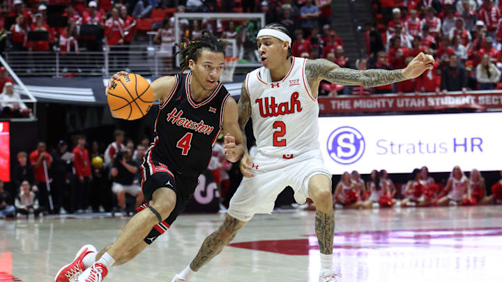 Feb 10, 2026; Salt Lake City, Utah, USA; Houston Cougars guard Kingston Flemings (4) drives to the basket against Utah Utes guard Terrence Brown (2) during the first half at Jon M. Huntsman Center. Mandatory Credit: Rob Gray-Imagn Images