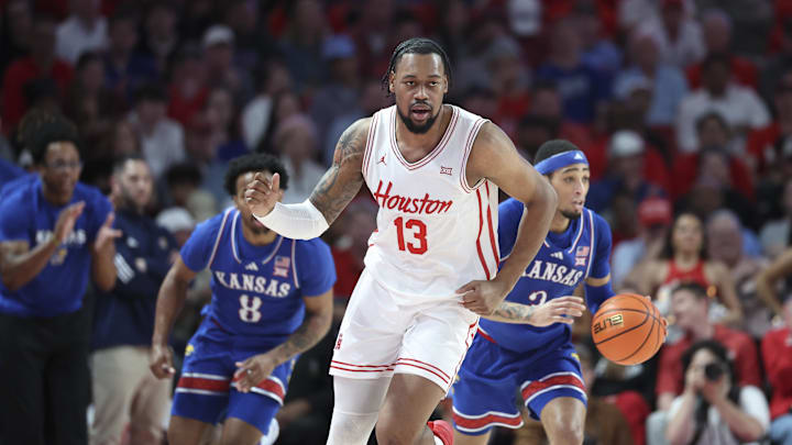 Mar 3, 2025; Houston, Texas, USA; Houston Cougars forward J'Wan Roberts (13) reacts and Kansas Jayhawks guard Dajuan Harris Jr. (3) brings the ball up the court after a play during the first half at Fertitta Center. Mandatory Credit: Troy Taormina-Imagn Images Mar 3, 2025; Houston, Texas, USA; Houston Cougars forward J'Wan Roberts (13) reacts and Kansas Jayhawks guard Dajuan Harris Jr. (3) brings the ball up the court after a play during the first half at Fertitta Center. Mandatory Credit: Troy Taormina-Imagn Images