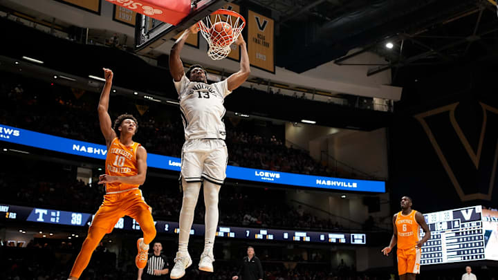 Vanderbilt forward Jalen Washington (13) dunks past Tennessee forward Nate Ament (10) aduring the second half at Memorial Gym in Nashville, Tenn., Saturday, Feb. 21, 2026. Vanderbilt forward Jalen Washington (13) dunks past Tennessee forward Nate Ament (10) aduring the second half at Memorial Gym in Nashville, Tenn., Saturday, Feb. 21, 2026.
