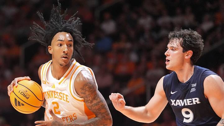 Tennessee guard Juke Harris (2) moves the ball while guarded by Xavier guard Ruben Dominguez (9) during a college basketball exhibition game on Oct. 15, 2026, in Knoxville, Tennessee. Tennessee guard Juke Harris (2) moves the ball while guarded by Xavier guard Ruben Dominguez (9) during a college basketball exhibition game on Oct. 15, 2026, in Knoxville, Tennessee.
