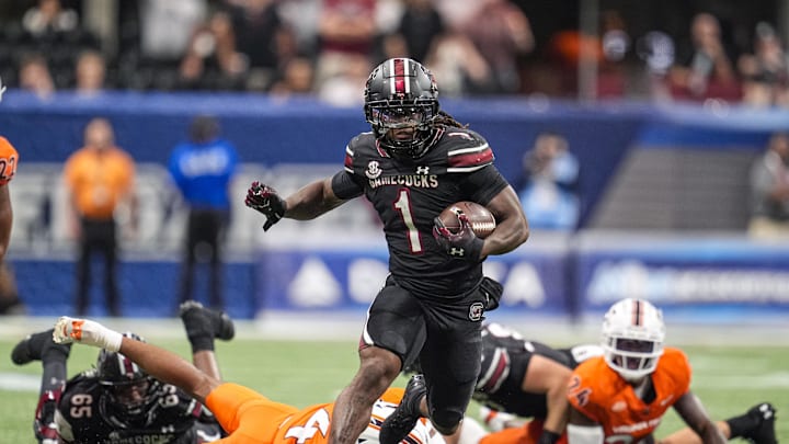 Aug 31, 2025; Atlanta, Georgia, USA; South Carolina Gamecocks running back Rahsul Faison (1) runs for a big gain against the Virginia Tech Hokies during the first half at Mercedes-Benz Stadium. Mandatory Credit: Dale Zanine-Imagn Images