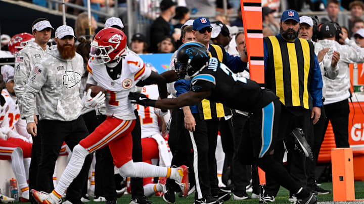 Nov 24, 2024; Charlotte, North Carolina, USA; Kansas City Chiefs wide receiver Xavier Worthy (1) with the ball as Carolina Panthers cornerback Michael Jackson (2) defends in the fourth quarter at Bank of America Stadium. Mandatory Credit: Bob Donnan-Imagn Images Nov 24, 2024; Charlotte, North Carolina, USA; Kansas City Chiefs wide receiver Xavier Worthy (1) with the ball as Carolina Panthers cornerback Michael Jackson (2) defends in the fourth quarter at Bank of America Stadium. Mandatory Credit: Bob Donnan-Imagn Images