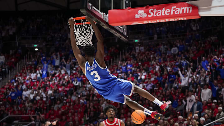 Jan 10, 2026; Salt Lake City, Utah, USA;  BYU Cougars forward AJ Dybantsa (3) dunks during the first half against the Utah Utes at Jon M. Huntsman Center. Mandatory Credit: Aaron Baker-Imagn Images