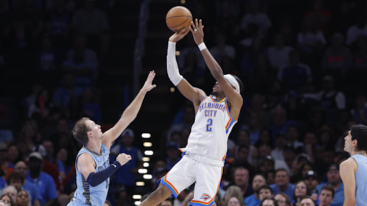 Mar 27, 2025; Oklahoma City, Oklahoma, USA; Oklahoma City Thunder guard Shai Gilgeous-Alexander (2) shoots over Memphis Grizzlies guard Luke Kennard (10) during the second half at Paycom Center. Mandatory Credit: Alonzo Adams-Imagn Images