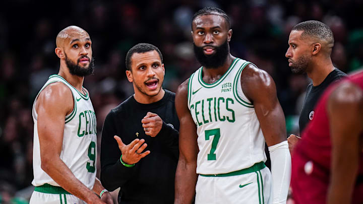 Dec 14, 2023; Boston, Massachusetts, USA; Boston Celtics head coach Joe Mazzulla talks with guard Jaylen Brown (7) and guard Derrick White (9) from the sideline as they take on the Cleveland Cavaliers at TD Garden. Mandatory Credit: David Butler II-Imagn Images