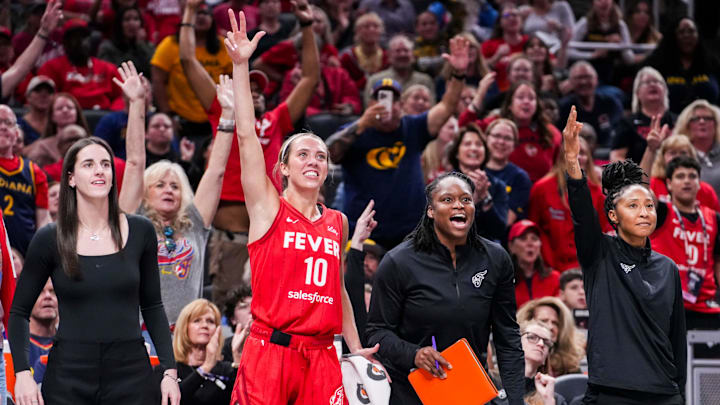 /Indiana Fever guard Caitlin Clark (22), Indiana Fever guard Lexie Hull (10), Indiana Fever assistant coach Karima Christmas-Kelly and Indiana Fever assistant coach Briann January celebrate Friday, Sept. 5, 2025, during a game between the Indiana Fever and the Chicago Sky at Gainbridge Fieldhouse in Indianapolis. The Indiana Fever defeated the Chicago Sky, 97-77.