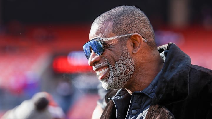 Dec 21, 2025; Cleveland, Ohio, USA;  Legendary football and baseball player and father of Cleveland Browns quarterback Shedeur Sanders, Deion Sanders on the sidelines prior to a game against the Buffalo Bills at Huntington Bank Field. Credit: Scott Galvin-Imagn Images
