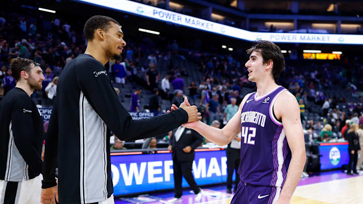 Mar 17, 2026; Sacramento, California, USA; San Antonio Spurs forward Victor Wembanyama (1) and Sacramento Kings center Maxime Raynaud (42) shake hands after the game at Golden 1 Center. Mandatory Credit: Sergio Estrada-Imagn Images