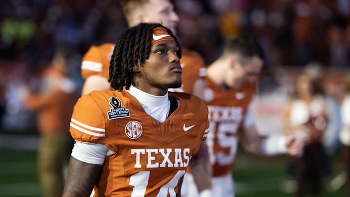 Dec 21, 2024; Austin, Texas, USA; Texas Longhorns wide receiver Aaron Butler (14) against the Clemson Tigers during the CFP National playoff first round at Darrell K Royal-Texas Memorial Stadium. Mandatory Credit: Mark J. Rebilas-Imagn Images