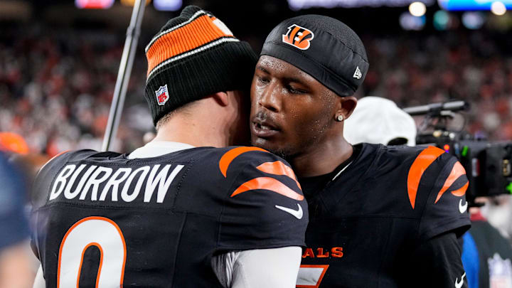Cincinnati Bengals quarterback Joe Burrow (9) and wide receiver Tee Higgins (5) celebrate the win after overtime of the NFL Week 17 game between the Cincinnati Bengals and the Denver Broncos at Paycor Stadium in downtown Cincinnati on Saturday, Dec. 28, 2024. The Bengals took a 30-24 win in overtime to remain in the post season chase.