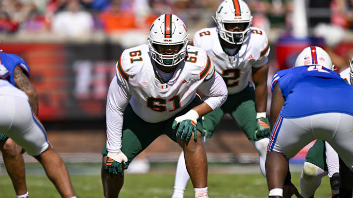 Nov 1, 2025; Dallas, Texas, USA;  Miami Hurricanes offensive lineman Francis Mauigoa (61) gets into position during the game between the Mustangs and the Hurricanes at Gerald J. Ford Stadium. Mandatory Credit: Jerome Miron-Imagn Images