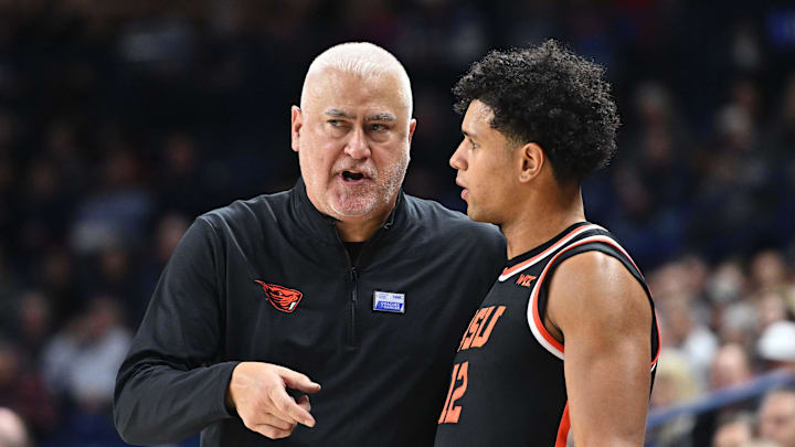 Jan 28, 2025; Spokane, Washington, USA; Oregon State Beavers head coach Wayne Tinkle talks with Oregon State Beavers forward Michael Rataj (12) during a game against the Gonzaga Bulldogs in the second half at McCarthey Athletic Center. Mandatory Credit: James Snook-Imagn Images