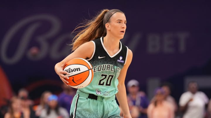 Sep 19, 2025; Phoenix, Arizona, USA; New York Liberty guard Sabrina Ionescu (20) dribbles against the Phoenix Mercury during the first half of game three of round one for the 2025 WNBA Playoffs at PHX Arena. Mandatory Credit: Joe Camporeale-Imagn Images