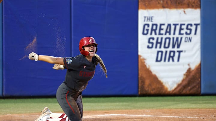 Stanford's Taryn Kern (99) celebrates after scoring a run in the third inning of a Women's College World Series softball game between the Stanford Cardinal and the UCLA Bruins at Devon Park in Oklahoma City, Sunday, June 2, 2024. Stanford won 3-1.