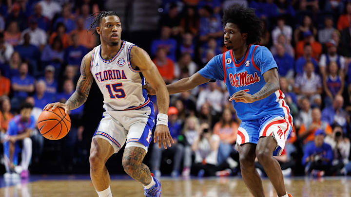 Mar 8, 2025; Gainesville, Florida, USA; Florida Gators guard Alijah Martin (15) dribbles the ball while Mississippi Rebels guard Jaylen Murray (5) defends during the second half at Exactech Arena at the Stephen C. O'Connell Center. Mandatory Credit: Matt Pendleton-Imagn Images