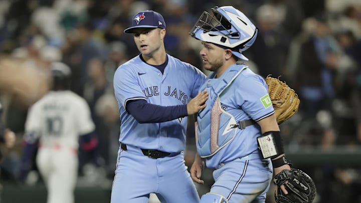 Toronto Blue Jays pitcher Mason Fluharty (68) and catcher Alejandro Kirk (30) celebrate after winning game three of the ALCS round for the 2025 MLB playoffs against the Seattle Mariners at T-Mobile Park. Toronto Blue Jays pitcher Mason Fluharty (68) and catcher Alejandro Kirk (30) celebrate after winning game three of the ALCS round for the 2025 MLB playoffs against the Seattle Mariners at T-Mobile Park.