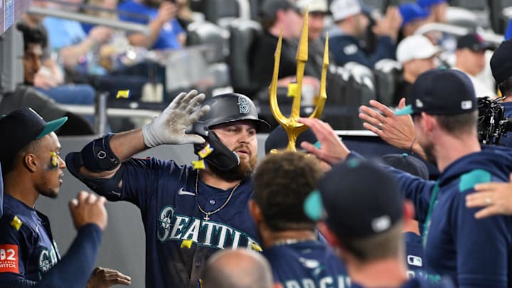 Seattle Mariners first baseman Rowdy Tellez (23) celebrates with teammates in the dugout after hitting a grand slam home run against the Toronto Blue Jays in the 12th inning at Rogers Centre on April 19.