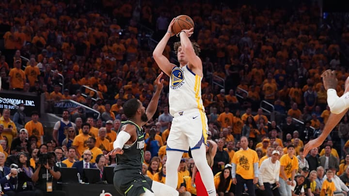 May 10, 2025; San Francisco, California, USA; Golden State Warriors guard Brandin Podziemski (2) shoots over Minnesota Timberwolves guard Mike Conley (10) in the second quarter during game three in the second round of the 2025 NBA Playoffs at Chase Center. Mandatory Credit: David Gonzales-Imagn Images