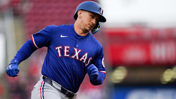 Texas Rangers outfielder Wyatt Langford (36) runs the bases after hitting a homer in the first inning of an MLB game between the Cincinnati Reds and Texas Rangers on April 1, 2025, at Great American Ball Park in Cincinnati.