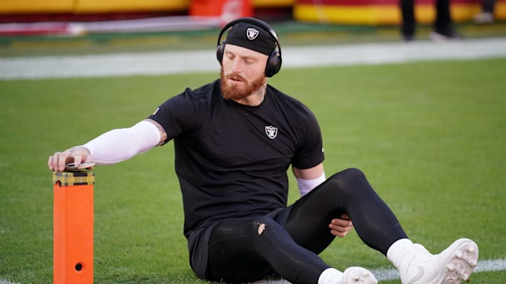 Oct 19, 2025; Kansas City, Missouri, USA; Las Vegas Raiders defensive end Maxx Crosby (98) stretches during warmups prior to the game against the Kansas City Chiefs at GEHA Field at Arrowhead Stadium. Mandatory Credit: Denny Medley-Imagn Images
