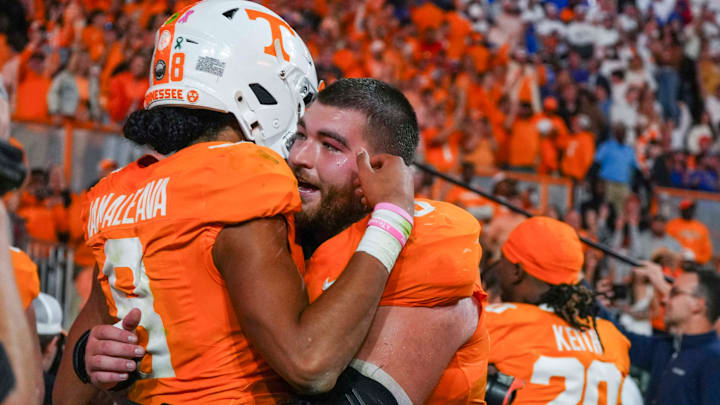 Tennessee quarterback Nico Iamaleava (8) and Tennessee offensive lineman Cooper Mays (63) hug after defeating Florida after a NCAA football game between Tennessee and Florida in Neyland Stadium, in Knoxville, Tenn., Oct. 12, 2024.