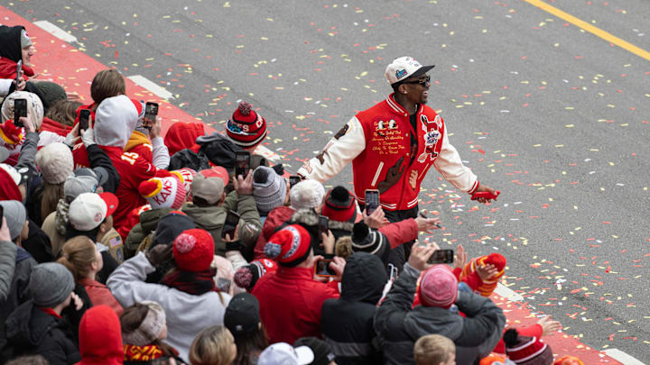 Feb 15, 2023; Kansas City, MO, USA; Kansas City Chiefs running back Jerrick McKinnon high fives fans at the Super Bowl LVII Champions Parade in downtown Kansas City, Mo. Mandatory Credit: Amy Kontras-Imagn Images