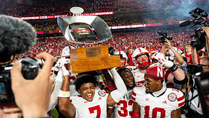 Nebraska defensive back Malcolm Hartzog Jr. hoists the Battle Sports Kansas City Classic trophy after his game-saving interception against Cincinnati. Nebraska defensive back Malcolm Hartzog Jr. hoists the Battle Sports Kansas City Classic trophy after his game-saving interception against Cincinnati.