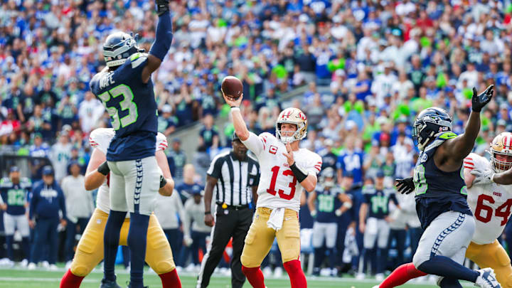 Sep 7, 2025; Seattle, Washington, USA; San Francisco 49ers quarterback Brock Purdy (13) passes against the Seattle Seahawks during the third quarter at Lumen Field. Mandatory Credit: Joe Nicholson-Imagn Images
