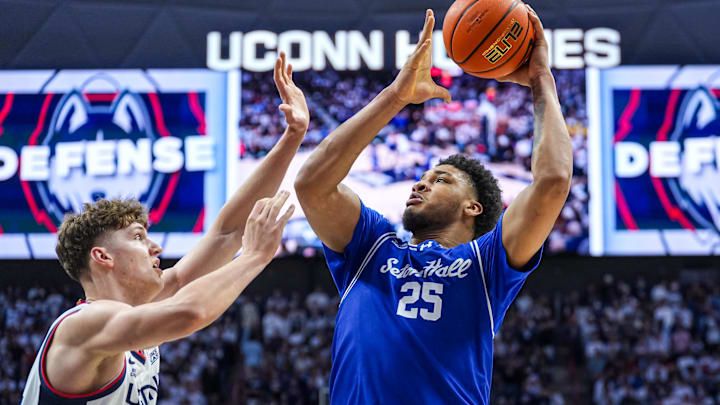 Feb 28, 2026; Storrs, Connecticut, USA; Seton Hall Pirates center Najai Hines (25) shoots the ball against UConn Huskies center Eric Reibe (12) in the second half at Harry A. Gampel Pavilion. Mandatory Credit: David Butler II-Imagn Images
