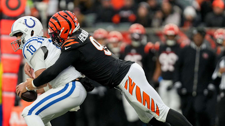 Cincinnati Bengals defensive end Trey Hendrickson (91) sacks Indianapolis Colts quarterback Gardner Minshew II (10) on Sunday, Dec. 10, 2023, during a game against the Cincinnati Bengals at Paycor Stadium in Cincinnati.
