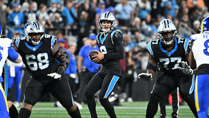 Carolina Panthers quarterback Bryce Young (9) looks to pass as guard Damien Lewis and offensive tackle Yosh Nijman block